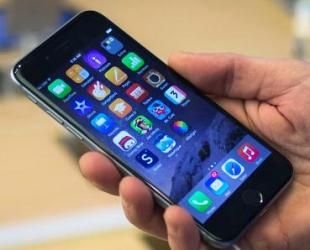 holding an Iphone 6 